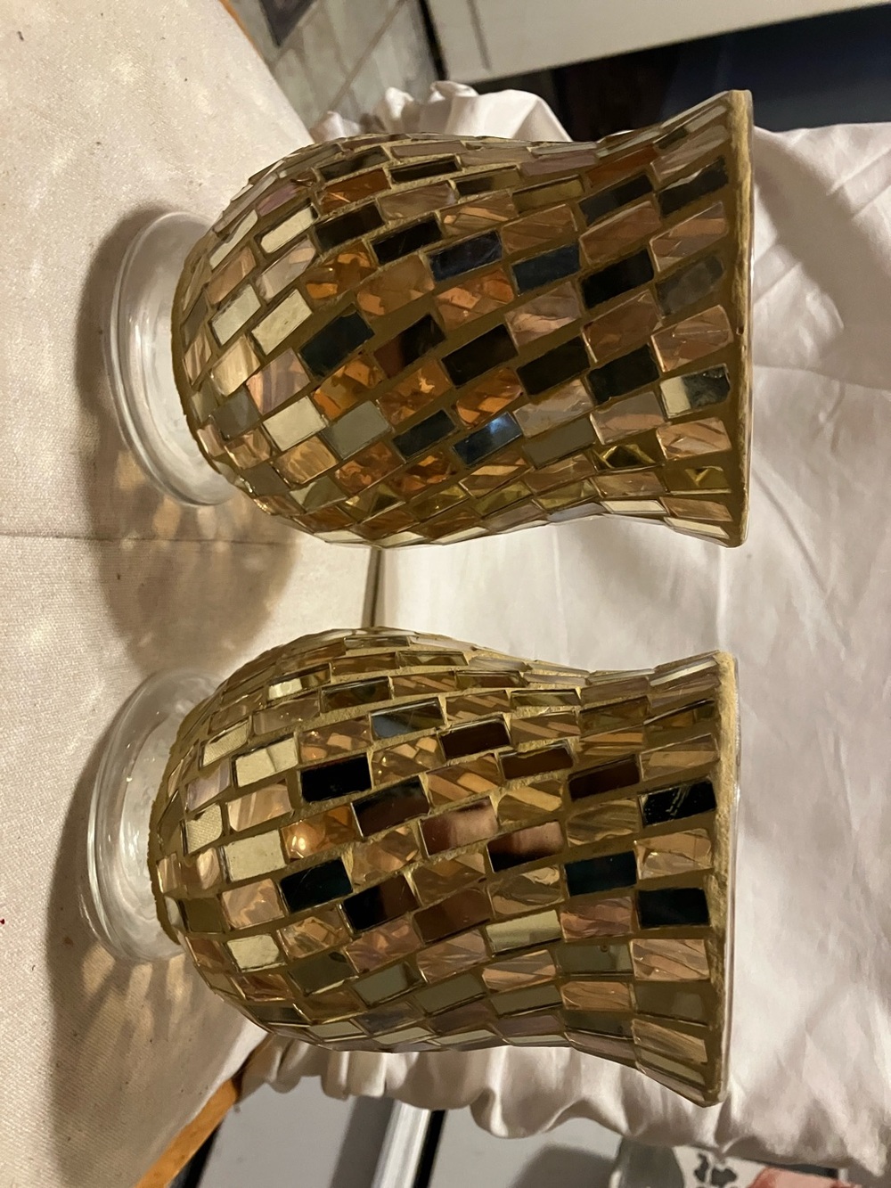 New.  Set of 2 gold mirrored glass 6” high - 4” wide candle or flower holders